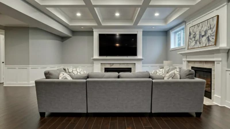 Finished basement remodeling in Greenville SC with coffered ceiling, recessed lighting, and custom living space by Burch Contracting