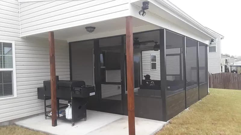 Aluminum screened porch installation in Five Forks SC with covered patio and outdoor living space by Burch Contracting