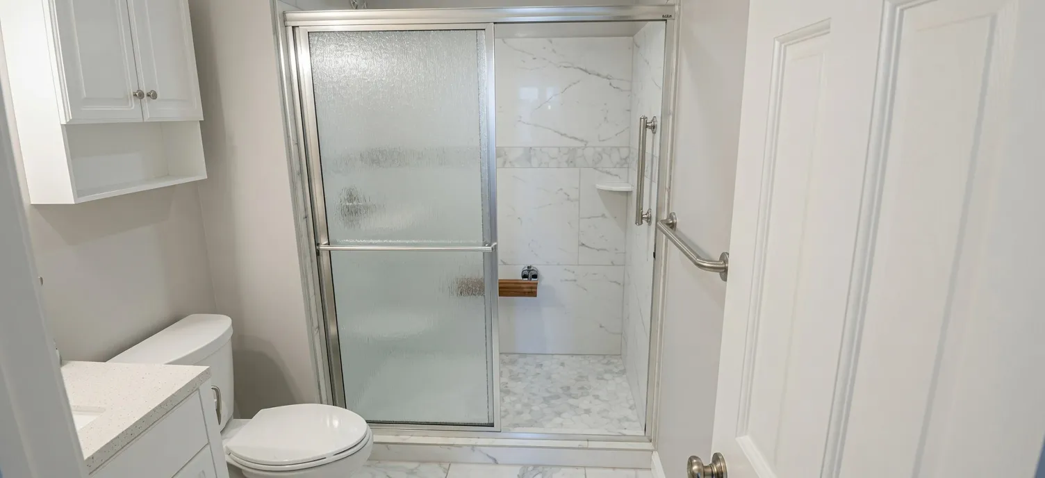 Accessible zero-entry roll-in shower conversion with grab bars in Simpsonville South Carolina
